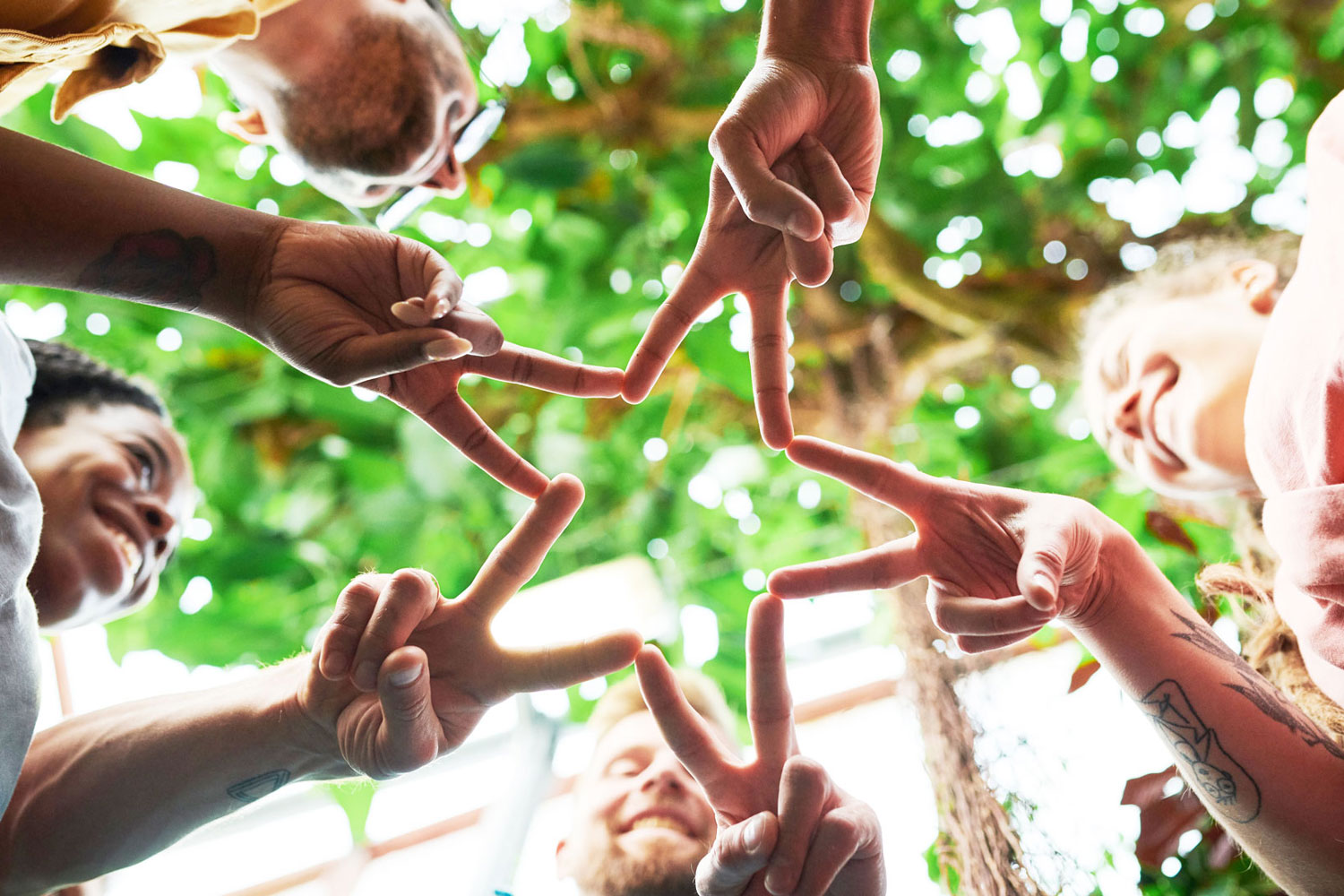 group of hands forming a star group of hands forming a star